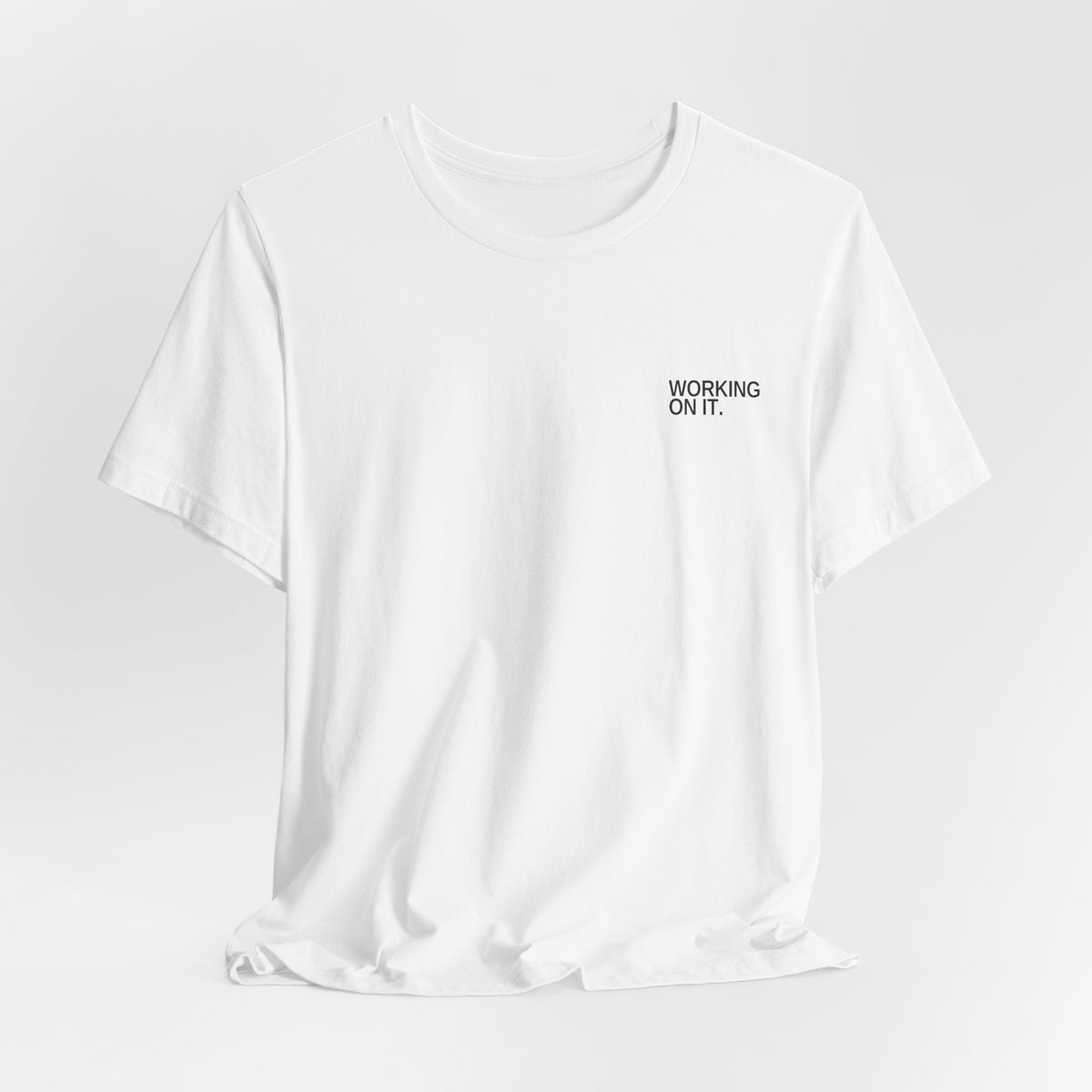 Working On It. Unisex T-Shirt